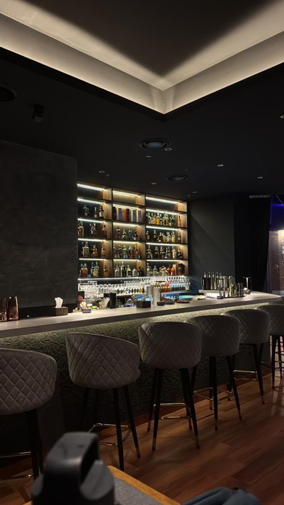 Bar counter and quilted stools at Tipsy Plus One