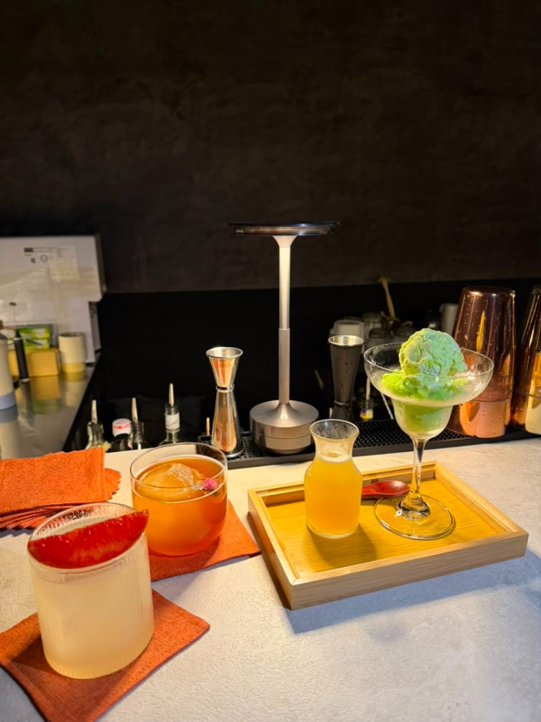 Crafted cocktails and dessert pour on the bar counter